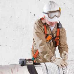 A field tech performing on site heat treatment services