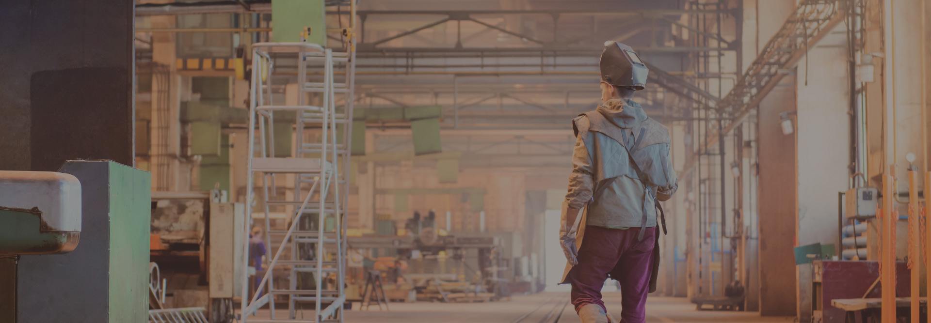 A worker in a fab shop using a post weld heat treatment furnace services